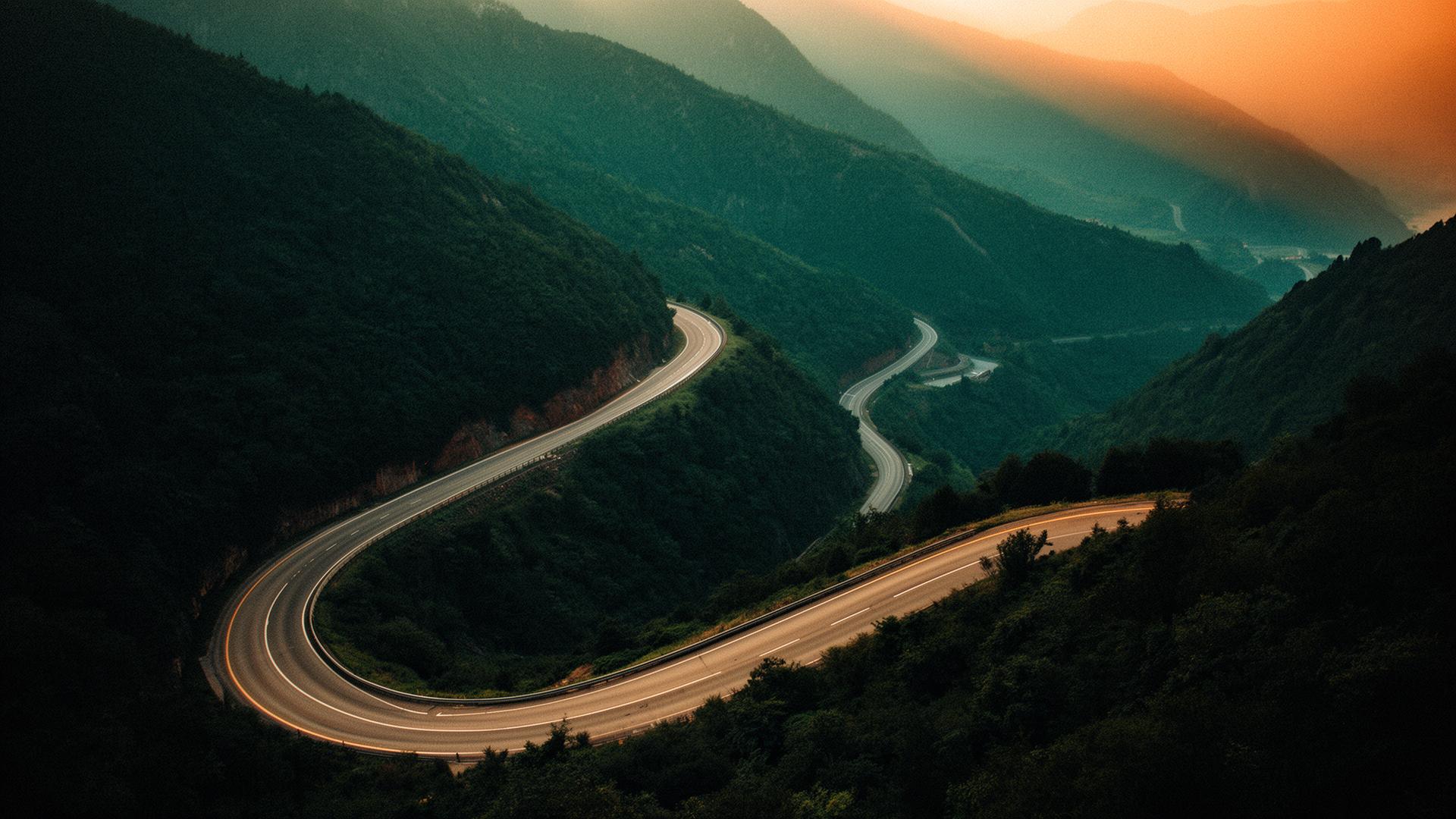 Winding mountain road at golden hour